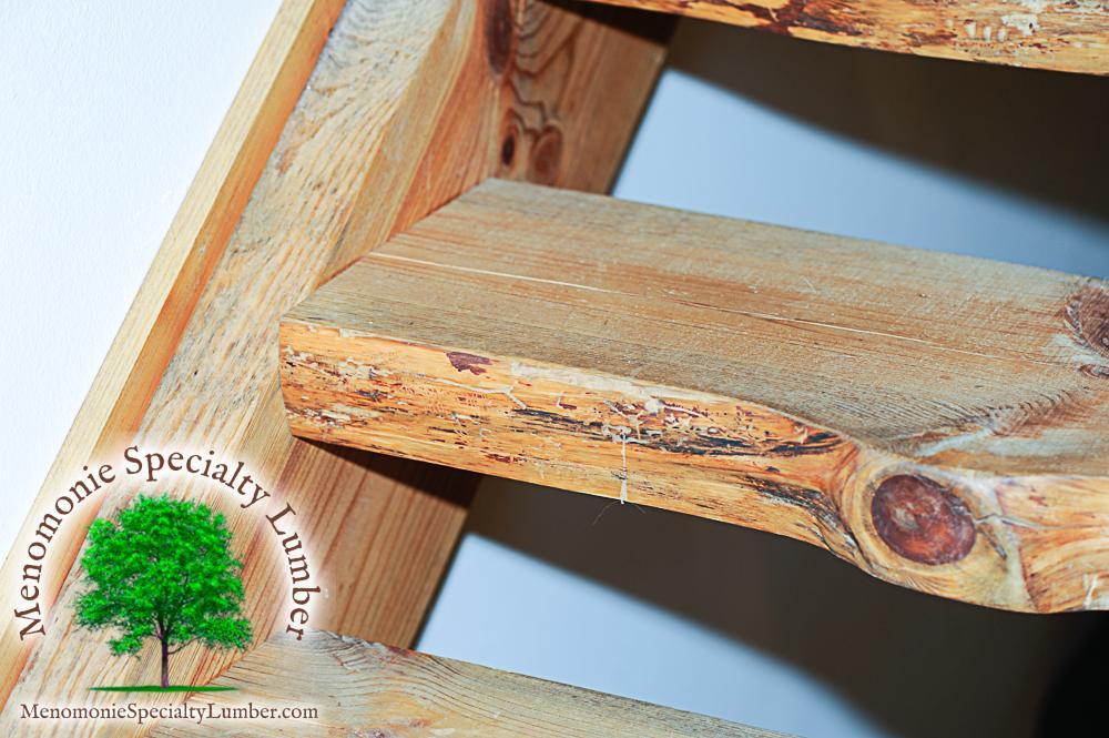 Salvaged Timber Pine Slab Stairway Custom handrail with steel rebar balusters.